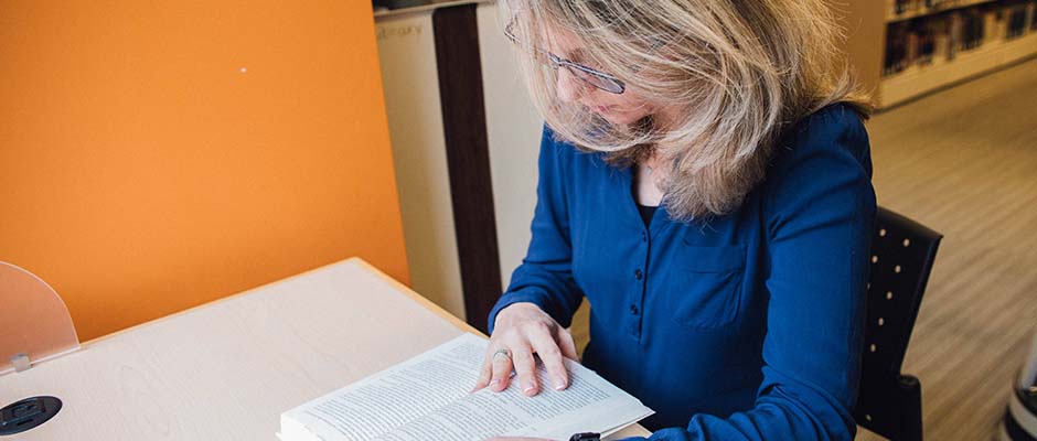 A woman reading a bible