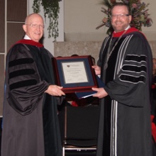 Dr. Bob Morris recieving Doctor of Divinity Honoris Causa from Dr. Gary Nelson in 2011