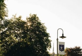 Tyndale campus with lampost Tyndale flag