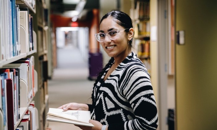 Women reading a book in the library