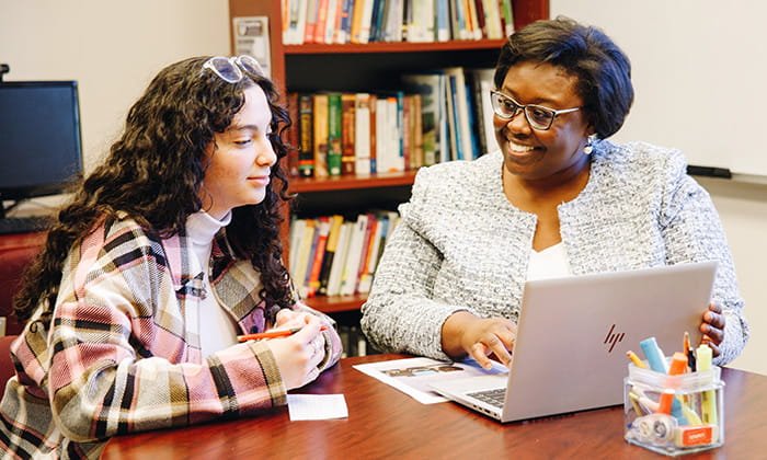 Centre for Academic Excellence staff helping a student