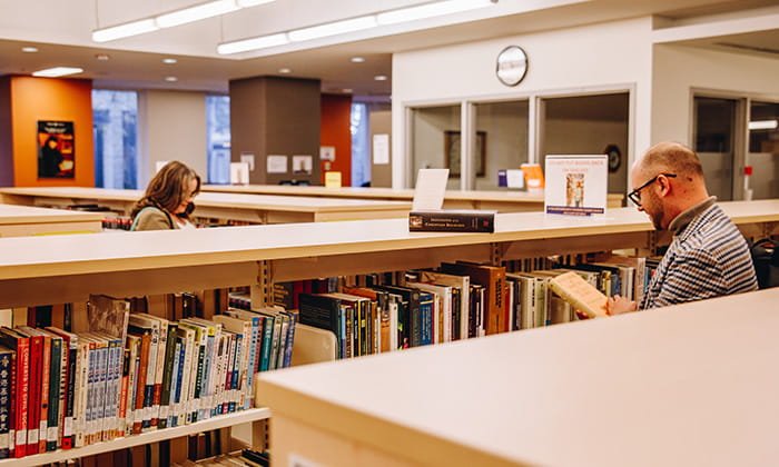 Students browsing in the library