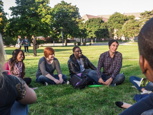 Students Sitting in a Circle Outside