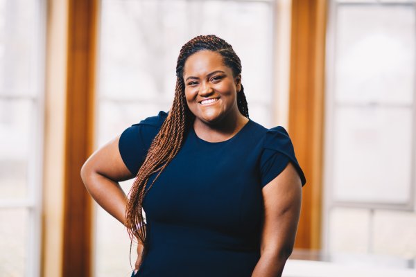 Woman smiling with hands on her hips, Natasha Daley