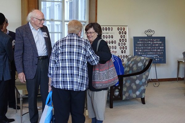 Alumni greeting one another