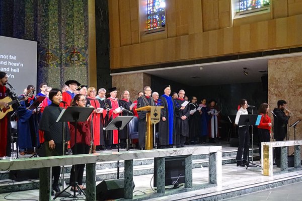 Faculty and worship team at front of chapel