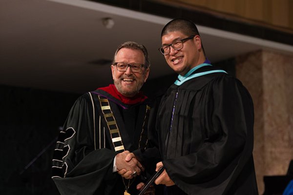 Graduate with Dr. Nelson
