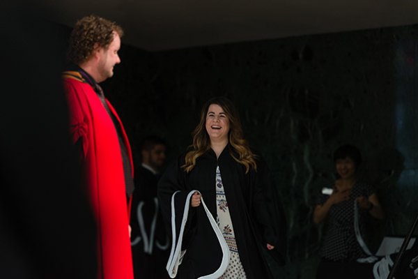 Graduate walking across the stage