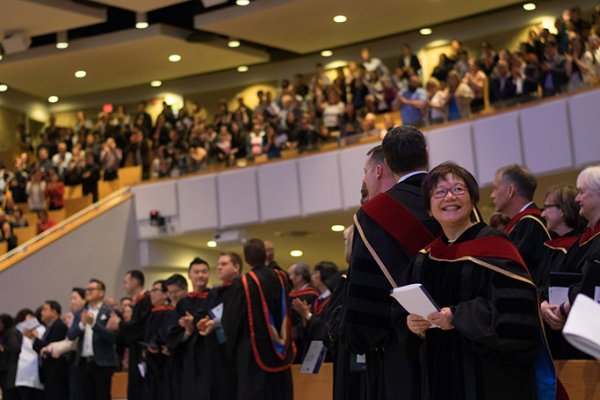 Graduates in the auditorium alongside attenders