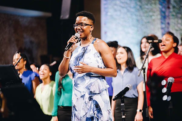 Jalesa Walkes singing on stage