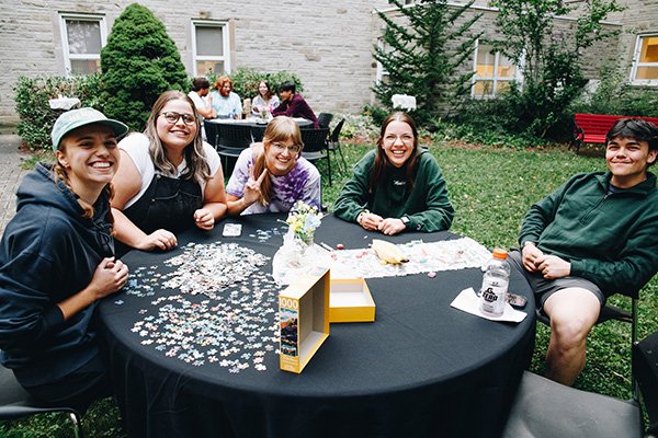 Students assembling a jigsaw puzzle