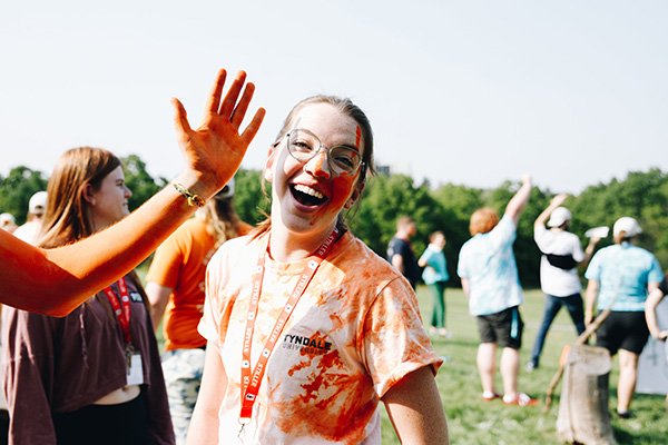 Smiling student with face painted