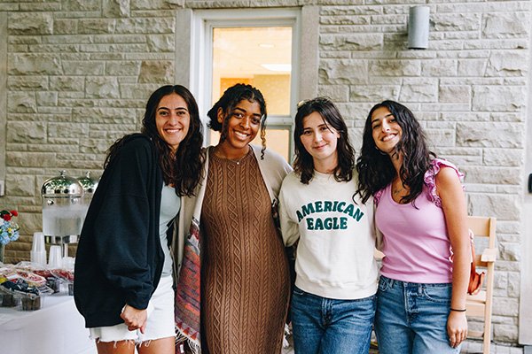 Four smiling students
