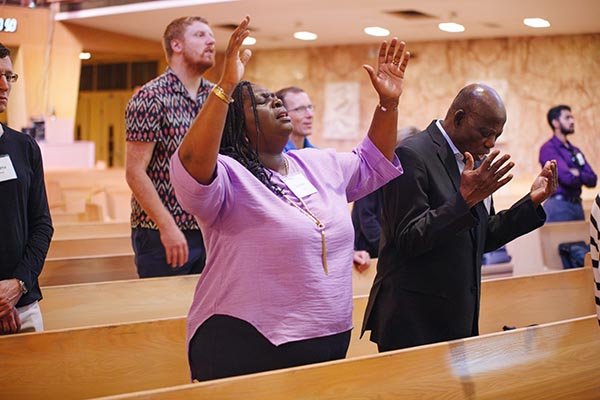 Alumni worshiping at the Chapel