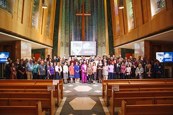 Wideshot of everyone at homecoming at the front of the chapel
