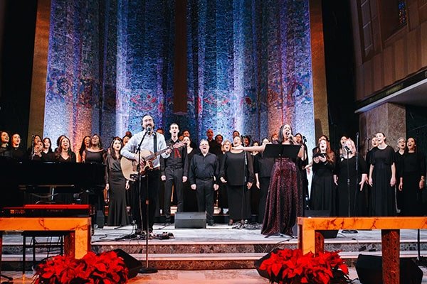 Choir singing led by Dr. Michell