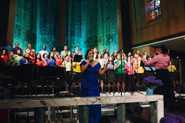 Dr. Melissa Davis singing with Tyndale Singers on stage
