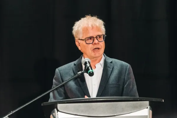 Dr. Van Johnson speaking at podium